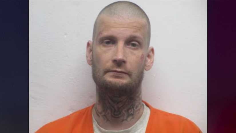 Wanted sex offender found hiding in secret compartment at home where woman was recently found dead
